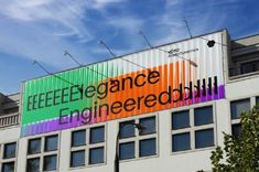 a large sign on the side of a building that reads eeeee elegance engineering