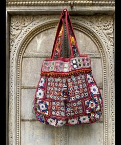 About bag  Indo-gypsy fusion, everyday use hand bag made from Banjara fabrics sourced from Vintage tribal costumes of regions of Rajastan and Gujarat. These are embellished with light catching coins, and intricate bead work tassels. Size - length 15 inches/ width 21 inches Company details:  Company name: Houseoftextile  Contact number: +919784447473  Email id: houseoftextile77@gmail.com  Shipping & custom : Delivery through one of the finest service providers : Skyway, Fedex, UPS  And DHL. Any l Email Id, Messenger Bags, Gmail Com, Bag Making, Bead Work, Ups, Accessory Gift, Electronic Accessories, Tote Bag