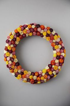 a wreath made out of flowers on a wall