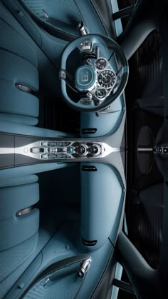 the interior of a car with blue leather and chrome trims is seen from above