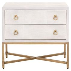 a white and gold dresser with two drawers on it's legs, one drawer open to the side