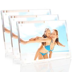 three clear acrylic frames with two women in bikinis and one is holding her arm around the other