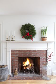 a fireplace with a wreath on the mantle