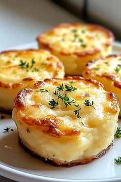 some food is on a white plate with green garnish and sprigs