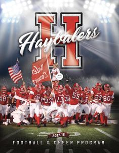 the football team is posing for a photo on the field with an american flag in front of them