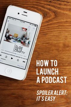 an iphone sitting on top of a wooden table next to a cup of coffee and the words how to launch a podcast