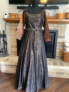 "This is a designer Renaissance in gorgeous chocolate and copper damask.  Zips up side.  Built in crinoline.  Sleeves are shades of brown and tie at top with grommet.  Neckline has amazing bronze chains and coins.  Waist has a cord tie with dangling coins. Chest 40\", waist 36\", length 60\". You will never see another like this." Bronze Medieval Dress, Macbeth Costumes, Asoiaf Fashion, Historic Dresses, Historical Outfits, Fair Outfit, Medieval Dresses, Medieval Era, Fantasy Outfits