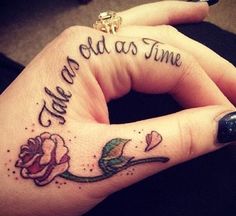 a woman's hand with a rose tattoo on it that says, we are old as time