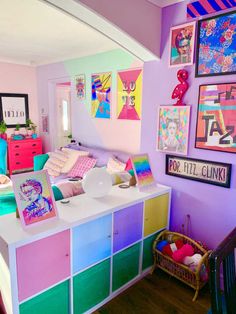 a room filled with lots of colorful furniture and pictures on the wall next to it