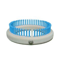 a blue and white hair comb sitting on top of each other in front of a white background