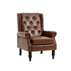 the brown leather chair is upholstered with black legs and an ornate buttoned back