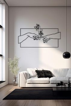 a living room with white furniture and black accents on the wall, along with a large painting