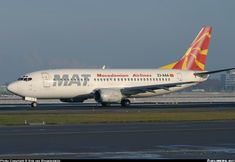 a large jetliner sitting on top of an airport runway