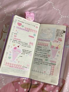 an open book with hello kitty stickers on the pages and pink polka dot sheets