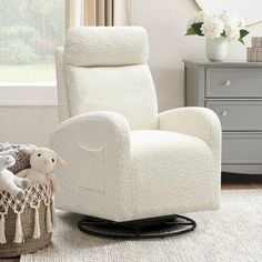 a white recliner chair sitting on top of a rug