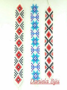 three beaded bracelets with red, white and blue beads hanging from the side