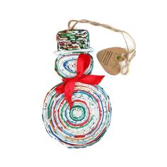 a snowman ornament with a red ribbon on it's neck and a tag hanging from the top