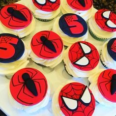 spiderman cupcakes are arranged in the shape of numbers on top of each other