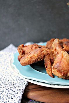 fried chicken wings on a blue plate