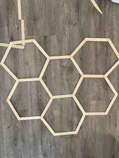 a piece of wood that has been cut into hexagons on the floor