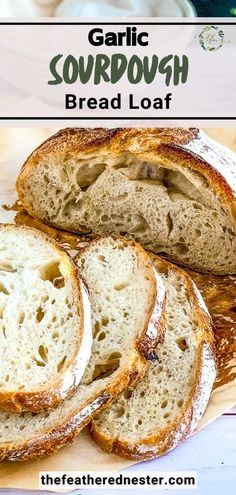 garlic sourdough bread loaf on a cutting board with text overlay that reads garlic sourdough bread loaf