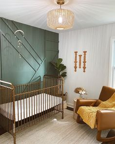 a baby's room with a crib, rocking chair and large potted plant