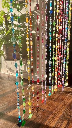 Multi-colored bead curtain with music pieces dangling from each end. Guitar picks, and cassettes, for the music lovers 🎶❤️ Suncatcher gems throughout each strand! ✨ Each strand is a solid color. With a total of 17 strands (Yellow, orange, red, pink, purple, blue, green).  🌟 MORE INFO ! 🌟 ✨ CUSTOM PIECES -I would be more than happy to  create a custom piece to match your home. If you would like to purchase a custom piece, please send me a message!  - This piece is sold as a set, if you would l Crystal Bead Curtain, Pink Beaded Curtains, Beads Curtain Ideas, How To Make A Beaded Curtain, Bead Curtain Doorway, Beaded Curtains Diy, Beaded Curtains Doorway, Beaded Wall Hanging, Bead Wall