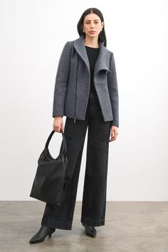 Handcrafted from 100% Italian virgin wool, our Essex offers pared-back contemporary styling in your new zip-up winter coat. Her off-center diagonal zipper fastens to create a high wrap neckline—structured enough to layer anything underneath comfortably (we've tested!). When worn open, by contrast, Essex offers artfully asymmetric lapels for additional visual interest. She's fully lined to keep you warm in cold temps and there are pockets to keep hands toasty, too.[SPLIT] Julia, in black and in m