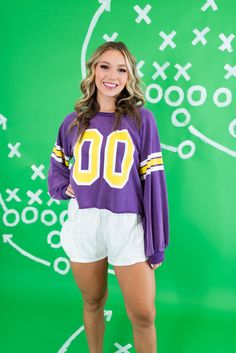 Jersey fabric material Scoop neckline Long sleeves Frayed hem Slightly cropped 80% Cotton; 20% Polyester SIZES: SMALL MEDIUM LARGE Get ready to cheer on the LSU Tigers in style with our Gameday Knit Sweater! In bold purple and yellow, this sweater is perfect for showing off your team spirit. Stay warm and cozy while looking cool. Geaux Tigers! SIZE XS S M L XL 2XL 3XL FITS A SIZE 00-0 2-4 6-8 10-12 14-16 18-20 22-24 Sporty Crew Neck Crop Top For Fall, Sporty Crew Neck Crop Top With Ribbed Cuffs, Casual Purple Game Day Top, Casual Purple Tops For Game Day, Lsu Gameday, Halloween Usa, Geaux Tigers, Platform Heels Boots, Sandal Platform