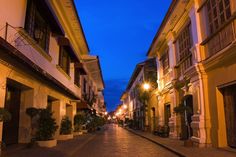 an empty city street at night with no people