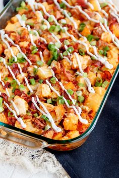 a casserole dish with chicken, bacon and green onions