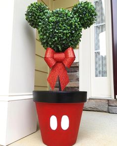 a potted plant with a red bow on it