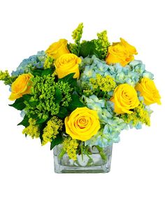 a vase filled with yellow and green flowers