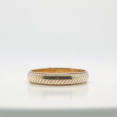 A very fine wedding band or ring.  By Tiffany & Co.  In 14k yellow gold.   With engraved diagonal lines around the circumference of the large half round band.  Simply a wonderful ring by Tiffany & Co.!  Date: 20th Century  Overall Condition: It is in overall good, as-pictured, used estate condition with some very fine & light surface scratches and other signs of expected light wear consistent with age.  Fineness: Marked 14k for gold fineness.   Marks: 14k / TIFFANY / D.J.N and N.A.P June 20 1959 Tiffany Milgrain Wedding Band, Tiffany Mens Wedding Band, Diagonal Line, Diagonal Lines, Wedding Ring Sizes, Modern Branding, Gold Band, Tiffany & Co., Gold Bands