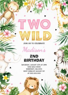 an animal themed birthday party with jungle animals and palm leaves, including zebras, giraffes, lions, and more