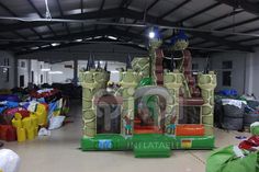 an inflatable castle is set up inside a warehouse