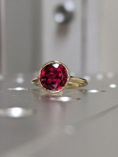 14k rose gold floating bezel ruby ring ruby engagement ring | Etsy Unique Ruby Rings, Engagement Ring Ruby, Ruby Solitaire Ring, Ruby Ring Gold, Ruby Rings, Meteorite Ring, Ring Ruby, Elegant Engagement Rings, Times New Roman