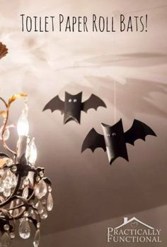 a chandelier with bats hanging from it's side and the words toilet paper roll bats above it