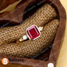 "MADE TO ORDER * Material: Solid gold(10K/14K/18K white/yellow/rose gold), Platinum, 925 Sterling Silver * DETAILS - Center Stone: Lab Created Red Ruby - Cut:Emearld Cut 7*8mm - Total weight: 2.5 ctw - Side stone: Moissanite - Total weight: 0.10 ctw (High Quality) - Cut: Round - Color: DF -  Clarity: VVS - Band Width: 2.0mm * Click on the \"Pin It\" icon if you like this item ✥ O T H E R ∙ I N F O R M A T I ON ✥ ♦ Your item will be nicely packed to gift in elegant jewelry boxes. ♦ Custom Order We can make custom rings in almost any shape and style. If you want a specific model, please send us a clear picture and we will do our best. ♦ Shipping Most items take 3-4 weeks to create.I'm happy to rush your order, fees may apply, write me for details. ♦ Payment Plans I offer payment plans. The m Yellow Gold Jewelry With Lab-created Ruby For Gift, Yellow Gold Jewelry With Lab-created Ruby For Anniversary, Yellow Gold Emerald Cut Ruby Ring Gift, Red 14k Gold Birthstone Ring For Anniversary, Red Birthstone Ring In 14k Gold For Anniversary, Red Ruby Ring In 14k Gold With Bezel Setting, Valentine's Day 14k Gold Red Ruby Ring, Red Ruby Ring Stamped 14k As Gift, Red 14k Gold Ring Gift