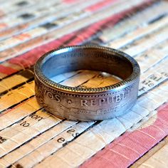 a coin ring sitting on top of a piece of paper