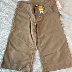 Womens Old Navy Size 8 Khaki Capris New With Tags Low Waist Casual Short Capris With Pockets, Casual Short Length Capris With Pockets, Casual Short-length Capris With Pockets, Relaxed Fit Cotton Knee-length Capris, Casual Cotton Short Capris, Casual Short Length Cotton Capris, Casual Cotton Short-length Capris, Casual Cotton Capris, Casual Capris With Built-in Shorts For Spring