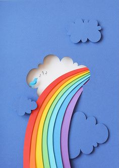 a card with a rainbow and clouds on it