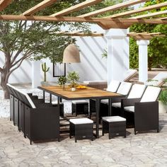 an outdoor dining table and chairs set under a pergolated roof