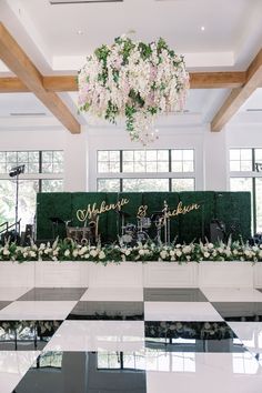 the reception table is decorated with flowers and greenery