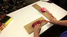 a person is doing crafts on a table