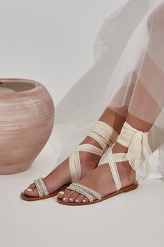 To discover the dreamy collection of our wedding sandals click the link below: https://www.etsy.com/shop/GreekChicHandmades?ref=seller-platform-mcnav&section_id=26050673 The dreamiest wedding sandals! Ultra chic and feminine our Urania bridal shoes are handcrafted in gold leather and feature two delicate toe straps with crystal and pearls embellishments that will flatter your feet. This luxurious style fastens with wrap-around the ankle laces handmade of airy silk in ivory which keep your fe Stone Embellished Open Toe Sandals For Wedding, Flat Heel Sandals With Rhinestones For Wedding, Flat Heel Rhinestone Sandals For Weddings, Embellished Open Toe Sandals For Reception, Wedding Shoes Flats For Bride, Bridal Sandals Flat, Boho Wedding Flats, Flats For Bride, Bridal Flat Sandals