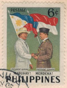 a stamp with two men shaking hands