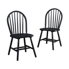 two black chairs sitting next to each other on a white background and one is empty