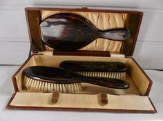 Luxurious French antique vanity boudoir grooming set, circa 1890s 1900s Victorian Edwardian era travel kit. Leather wrapped case, champagne silk lined, faux tortoise mirror, hair brush and clothes brush matching set. Ornate gilt trim around the rim of each piece. Secure closing brass hinged box. Beautiful decor and functional set. Good used vintage condition, natural patina and wear commensurate with age, see pics. View other antique boudoir and apothecary items in my shop at www.etsy.com/shop/R Tortoise Mirror, Antique Vanity Accessories, Edwardian Hair Care, Antique Makeup Brush Holder, Vintage Hair Brush Set, Vintage Makeup Train Case, Vintage Hair Accessories