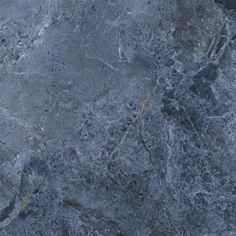 a close up view of the surface of a marbled floor with cracks in it